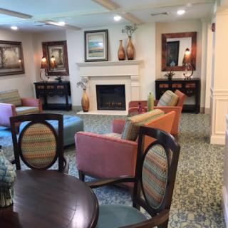 A cozy living room setup featuring a fireplace and comfortable seating.