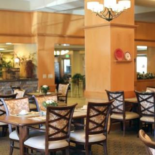 Elegant dining area with neatly arranged tables and chairs.