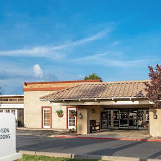 A charming commercial building under a clear blue sky.