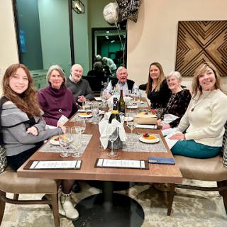 A wonderful evening spent with friends around a dinner table.