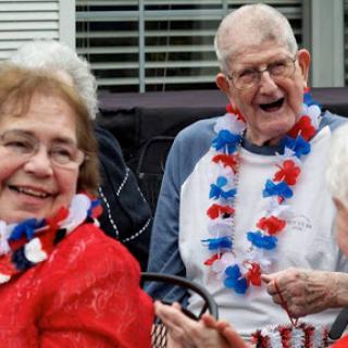 Joyful seniors celebrating together with a patriotic spirit.