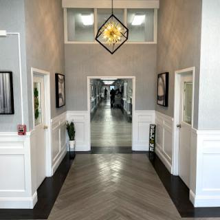 A contemporary hallway featuring elegant lighting and stylish decor.