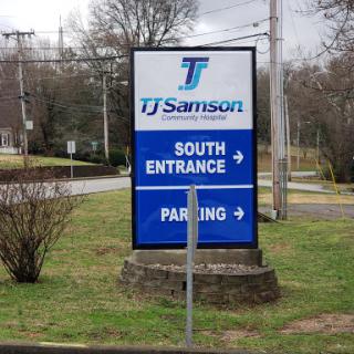 Directional sign for TJ Samson, indicating the south entrance and parking area.