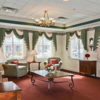 A traditional living room with elegant furnishings and natural light.