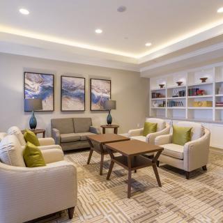 A modern living room with elegant furniture and decor.