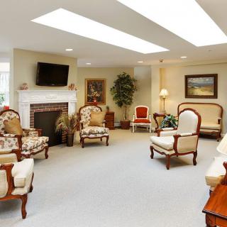 A cozy living room with elegant furniture and a fireplace.