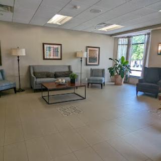 A cozy waiting area with comfortable seating and natural light.