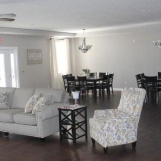 A modern open-concept living and dining space with comfortable seating and elegant furnishings.