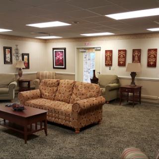 A cozy living room featuring comfortable seating and decorative elements.