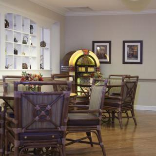A cozy dining area featuring a vintage jukebox and stylish furniture.