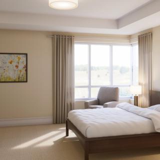A minimalist bedroom with a window, bed, chair, and artwork on the wall.
