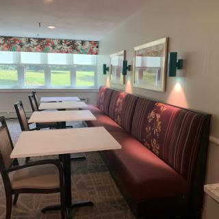 Cozy dining area with comfortable seating and natural light.