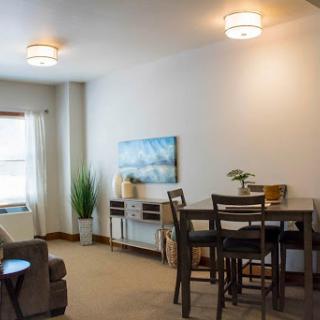 A cozy and modern living space featuring a dining area and stylish decor.