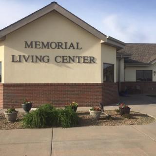 Front view of the Memorial Living Center building with clear signage.