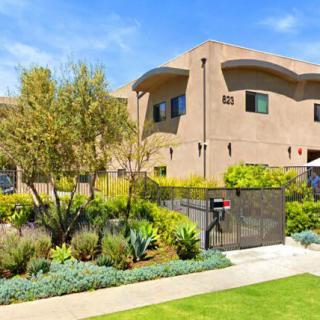 A modern residential house with a landscaped garden and greenery.