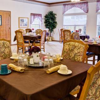 A well-decorated dining area with tables set for a meal.