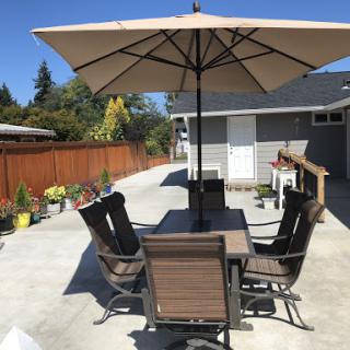 A well-furnished outdoor patio area ready for relaxation and dining.