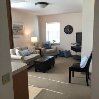 A cozy living room with comfortable seating and modern decor.