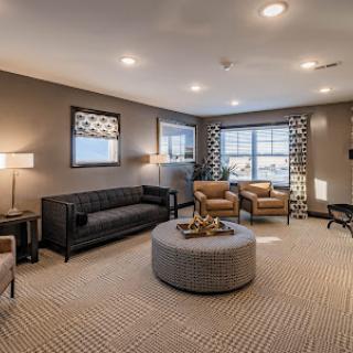 A stylish and inviting living room with modern furnishings and warm lighting.