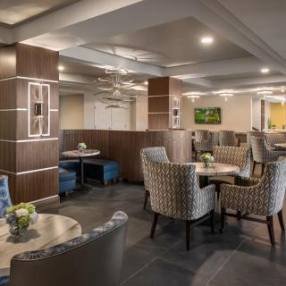 A modern hotel lounge with comfortable seating and elegant decor.