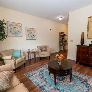 A cozy living room with stylish furniture and decorative elements.