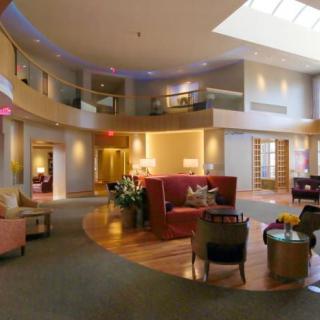 A modern lobby with elegant furniture and well-lit interior.