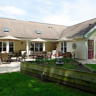 A cozy residential house with a spacious patio and garden area.