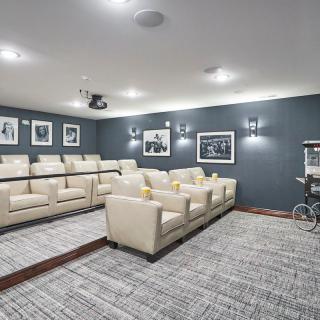 A modern home theater with comfortable seating and a projector for an immersive viewing experience.