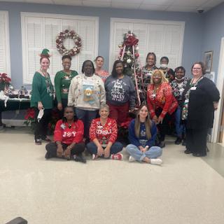 A cheerful gathering celebrating the holiday season with festive attire and decorations.