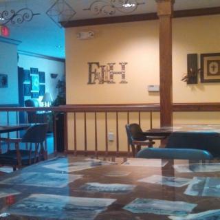 A cozy restaurant interior with neatly arranged tables and chairs.
