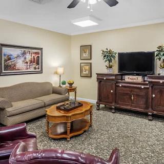 A cozy living room with comfortable seating and elegant decor.