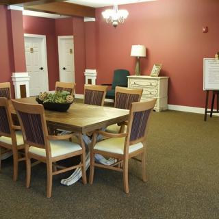 A well-appointed dining area with a large table and elegant decor.