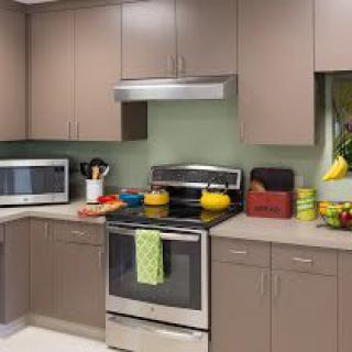 A modern kitchen with sleek cabinetry and stainless steel appliances.