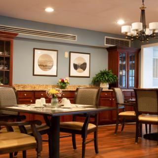 Cozy dining room with elegant furnishings and warm lighting.