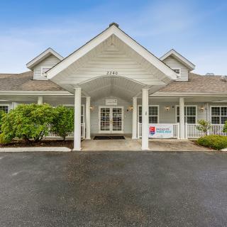 Front view of a residential building with a covered entrance.
