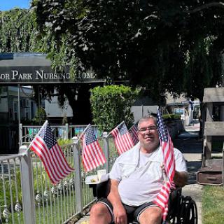 A joyful moment in the park, celebrating community and patriotism.