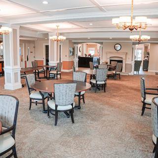A spacious and cozy dining area with elegant decor and ample seating.