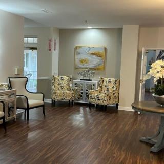 Elegant lobby seating area with stylish decor and artwork.
