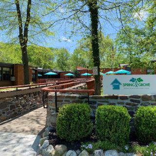 A vibrant outdoor dining area surrounded by lush greenery.