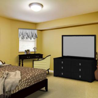 A cozy bedroom with a bed, dresser, mirror, and window.