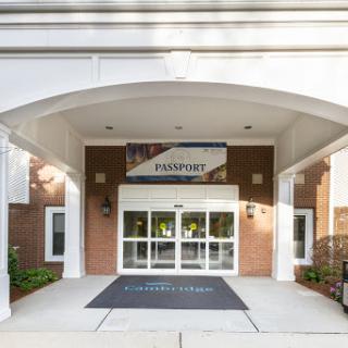 The entrance to a welcoming building featuring a prominent sign.