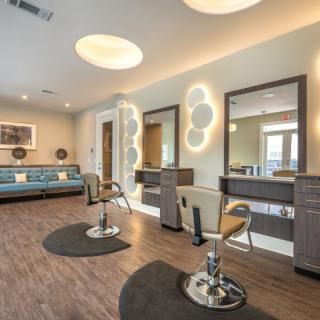Modern salon interior with stylish design and comfortable seating.