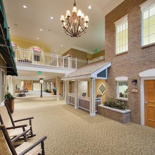 Spacious lobby area with a chandelier and comfortable seating.