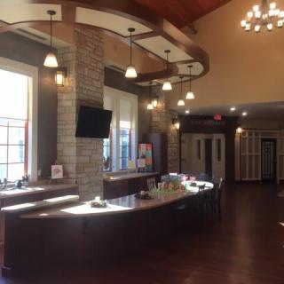 A modern reception lobby with a stylish desk and ambient lighting.