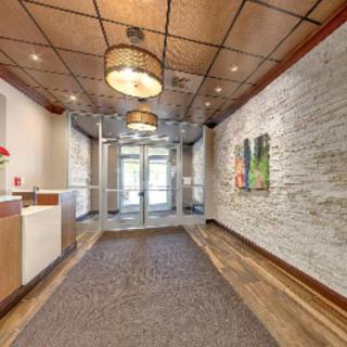 A modern lobby with stylish lighting and artwork.