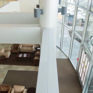 A modern lobby with comfortable seating and large windows allowing natural light.