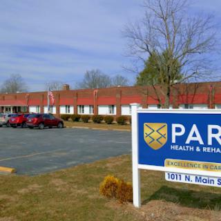 Exterior view of a health and rehabilitation facility with clear signage.