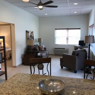 A modern open living space with comfortable furniture and ample natural light.