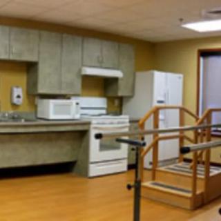 A therapy room designed to resemble a kitchen for rehabilitation purposes.