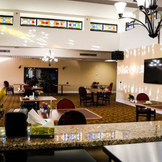 A cozy restaurant interior featuring elegant lighting and a welcoming dining atmosphere.